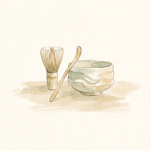 Set de utensilios de bambú para matcha: chasen, chashaku y un chawan de cerámica clara sobre una mesa de madera